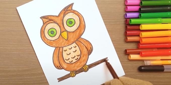 Hoe een uil te tekenen: verf over de ogen, benen en een tak
